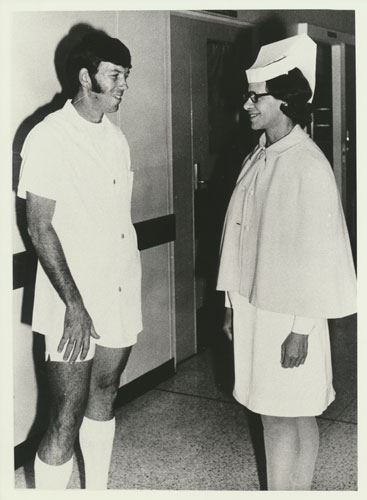 Matron Norma West speaking with outstanding nursing graduate Brian Sedgman 1974