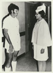 Matron Norma West speaking with outstanding nursing graduate Brian Sedgman 1974