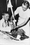 Nurse Elizabeth (Betty) Francis (later Elizabeth West) with patient, Christmas 1948